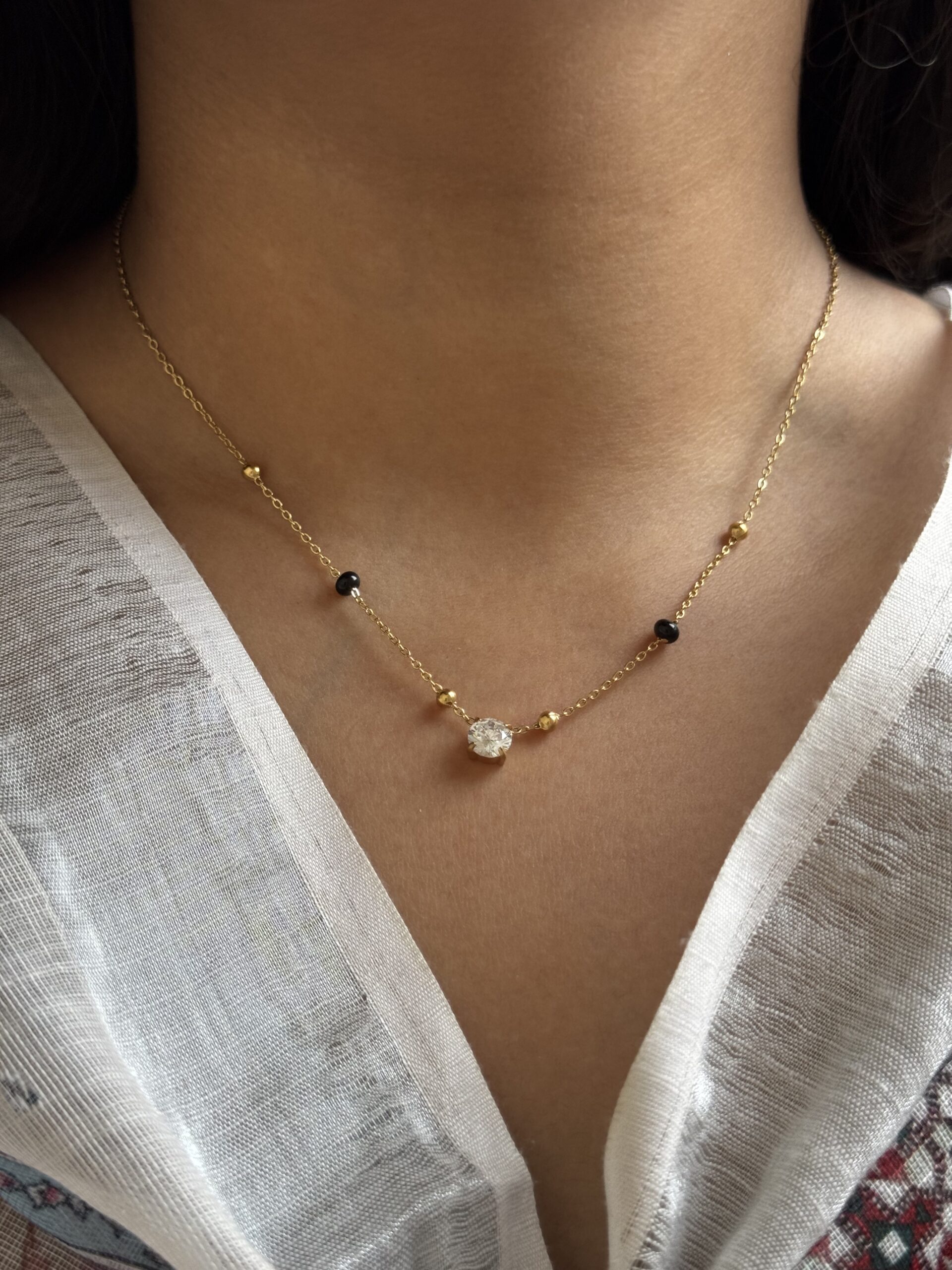 anti tarnish modern gold mangalsutra necklace with black beads for women, modern anti tarnish gold mangalsutra with black beads, waterproof daily wear mangalsutra necklace for women, elegant gold finish anti tarnish mangalsutra, stylish black bead mangalsutra for everyday wear, minimal modern mangalsutra necklace in gold finish, anti tarnish mangalsutra jewellery for women, lightweight waterproof gold mangalsutra necklace
