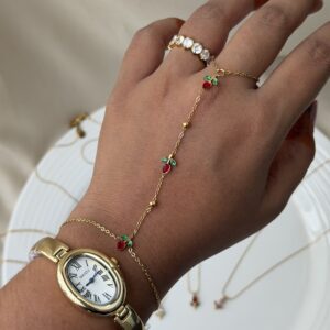 tulip hand chain jewellery for women, anti tarnish tulip hand chain in gold finish, elegant tulip hand chain with bracelet, waterproof gold hand chain for women, delicate tulip hand chain jewellery, stylish gold hand chain for festive occasions, trendy tulip hand chain accessory, modern anti tarnish hand chain, beautiful gold tulip hand chain, traditional hand chain jewellery with tulip design