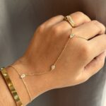 anti tarnish gold hand chain bracelet for women, elegant gold hand chain with finger ring, waterproof hand chain jewellery for women, stylish anti tarnish hand bracelet, delicate gold hand chain for everyday wear, trendy hand chain with finger ring, lightweight gold hand chain jewellery, modern hand chain bracelet for women