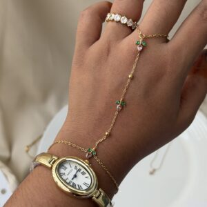 tulip hand chain jewellery for women, anti tarnish tulip hand chain in gold finish, elegant tulip hand chain with bracelet, waterproof gold hand chain for women, delicate tulip hand chain jewellery, stylish gold hand chain for festive occasions, trendy tulip hand chain accessory, modern anti tarnish hand chain, beautiful gold tulip hand chain, traditional hand chain jewellery with tulip design