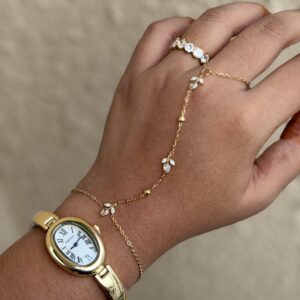 tulip hand chain jewellery for women, anti tarnish tulip hand chain in gold finish, elegant tulip hand chain with bracelet, waterproof gold hand chain for women, delicate tulip hand chain jewellery, stylish gold hand chain for festive occasions, trendy tulip hand chain accessory, modern anti tarnish hand chain, beautiful gold tulip hand chain, traditional hand chain jewellery with tulip design